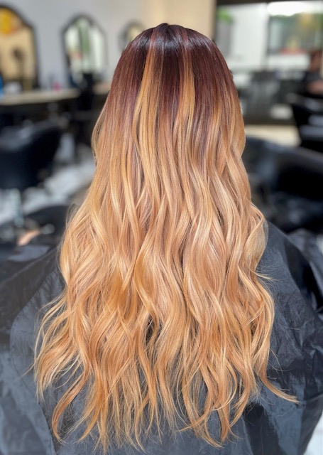 A photograph taken by Beautify Salon and Spa in Henderson las Vegas, the lady in the photograph has added hair extensions for extra length and added color for depth and shine