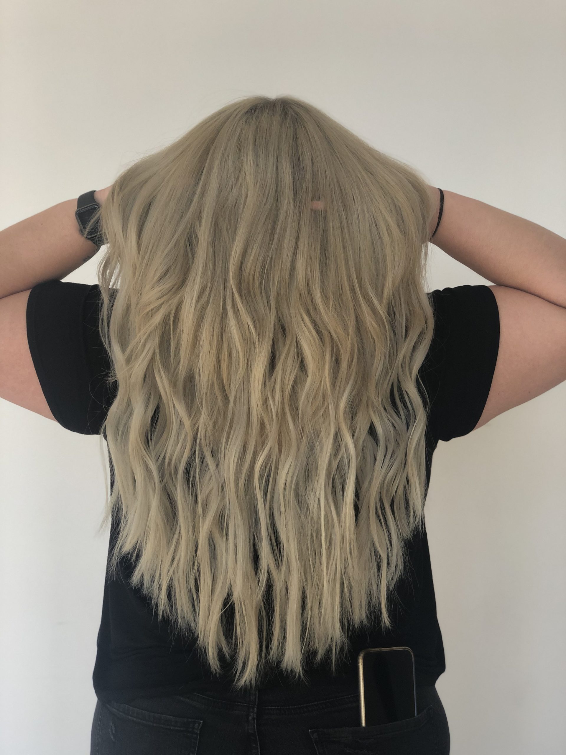 Long ash blond hand tied hair extensions done by Beautify Salon and Spa in Henderson Las Vegas